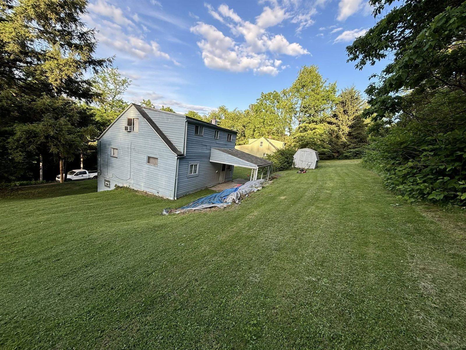 Landscaping work — freshly mulched beds and trimmed lawn
