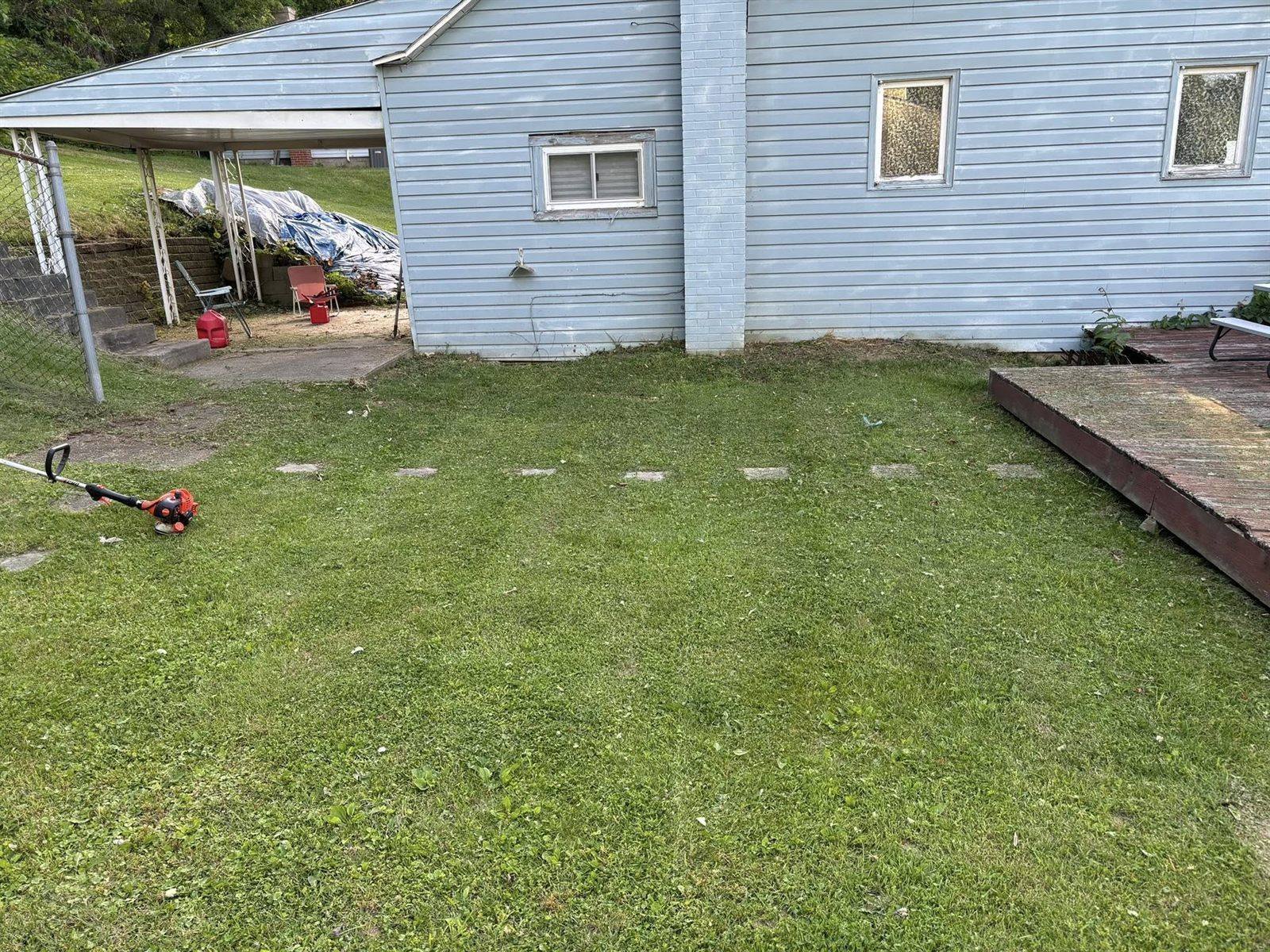 Lawn and yard cleanup — edged walkway and cleared debris