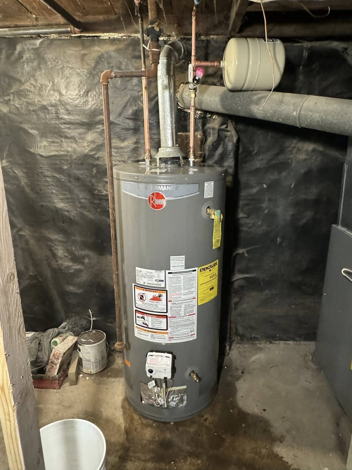 Completed water heater repair job — clean and ready